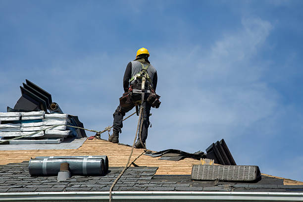 Professional Gutter Installation technician working in Lakeville, MA